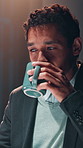 Business, night and man in office, coffee and online reading with copywriting, deadline and thinking. Person, evening or journalist in workplace, cappuccino or late shift with pressure or news report