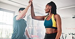 Warm up, exercise and high five with personal trainer, class and gym for training or fitness routine. Coaching, goals and workout with man and woman in health club together for muscle target success