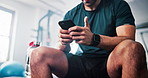 Break, exercise and man with phone in gym relax after fitness, training and workout routine. Sports health club and happy person rest on smartphone for typing message, social media and connection