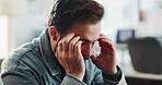 Man, headache and stress in office, worry and frustrated with pressure, anxiety or deadline at company. Person, migraine and tired on sofa, fatigue and mental health with burnout at creative agency