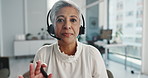 Face, woman and headset with video call in office for communication, advice and customer support. Mature agent, discussion and webinar for online consultation, contact us and procedure for solution