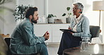 Therapy, consulting and man with therapist in office for counseling, advice and emotional support. Psychology, mental health and woman with clipboard for writing notes, patient diagnosis and session