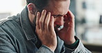 Man, headache and stress in home, worry or frustrated with depression, anxiety or grief for loss. Person, migraine and overwhelmed with pain, fatigue and mental health with burnout in living room