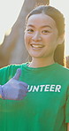 Woman, student and smile with thumbs up for volunteer with outdoor, community work and earth day event. Female person, charity support and happy for skill development, recycling and university break