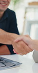 Business people, handshake or meeting with documents for agreement, partnership or deal at office. Closeup, employees or colleagues shaking hands with contract for thank you, greeting or introduction