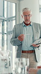 Meeting, tablet screen and businessman in office with presentation for statistics, graphs or charts. Technology, discussion and mature male financial analyst with data for company investment planning