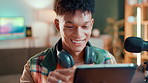 Happy man, podcaster and home with tablet for research, news trend or live streaming platforms. Male person, influencer or digital designer with smile on technology or checking topic for discussion