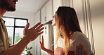 Angry, conflict and couple with argument in home for toxic marriage, betrayal and disagreement. Divorce, liar and frustrated people with conversation, relationship drama and fight for cheating affair