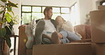 Talking, relax and couple on couch in new home with property, investment or loan success. Moving, sofa or people in relationship with security, tenant or real estate for relocation or love in house