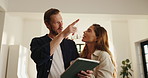 Couple, talk and pointing with tablet at new house for planning, online shopping and renovation idea. People, discussion and digital for research, interior design and decoration for remodeling choice