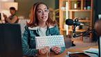 Recording, live streaming and woman with keyboard for review, opinion or demonstration for content creation. Promotion, product feedback and gaming influencer with tech for vlogging on social media.