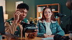 Live streaming, social media and vr headset with influencer people in home studio for broadcast. Team, tech and video with content creators at desk in apartment for product promotion or review