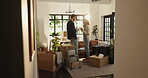 Couple, talking and tablet with boxes at new home for planning, online shopping and renovation ideas. People, discussion and digital for research, interior design and decoration for remodeling choice
