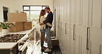 Romantic, boxes and couple hug in new home with property, investment or loan success. Moving, celebrate or people in relationship with security, tenant or real estate for relocation or love in house