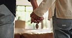 Holding hands, keys or couple in new home with property, investment together or loan success. Moving, marriage or people in relationship with security, support or real estate for relocation or love