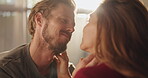 Smile, couple and touch with love at house for romance, affection and connection of relationship. People, passionate and partner comfort with special moment, bonding together and marriage commitment