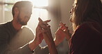 Hands, smile and couple with love at house for romance, affection and connection of relationship. People, touch and date with partner for special moment, bonding together and commitment for marriage