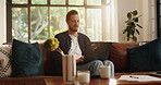 Remote work from home, thinking and man on sofa, laptop and problem solving with online editing. Person, freelancer or writer on couch, pc or research for article, creativity or feedback for proposal