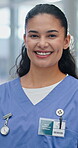 Face, woman and nurse with smile for healthcare, medical support and professional with confidence. Clinic, female person and general practitioner in portrait for about us, nursing career and wellness