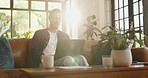 Remote work from home, video call and man on sofa, laptop and virtual meeting in living room. Person, copywriting and freelancer on couch, computer and online conference with webinar or communication