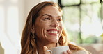 Laughing, coffee and woman on sofa in home for calm, relaxing and peaceful morning on weekend. Smile, daydreaming and female person with cup of warm beverage, tea or latte in living room at apartment