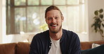 Face, couch or man with smile in living room to relax for wellness, weekend or leisure. Face, smile or proud person with confidence, sofa or good mood for satisfaction or resting in home in England