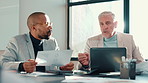 Business people, laptop and men in office, documents and cooperation with budget report. Employees, accounting or financial advisor in meeting, computer or planning for profit growth or brainstorming