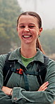 Face, hiking and woman with arms crossed, wellness and journey with wellness, explore and pride. Portrait, happy person and hiker in forest, nature and environment with trekking, smile and vacation