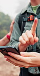 People, hands and hiking with phone for app, navigation system or path finding in outdoor forest. Closeup, hikers or trekking with mobile smartphone for map location, destination or tracking route