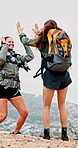 Excited women, hiking or high five with backpack in nature for mountain journey, success or goals. Happy, female people or hikers winning with jump in celebration for trekking adventure in forest