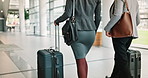 Business people, legs and luggage at airport with walking, terminal and partnership on corporate trip. Team, suitcase and employee on travel, baggage and together in lobby for boarding flight