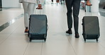 Business people, legs and suitcase at airport with running, terminal or rush in hallway on corporate trip. Team, luggage and employee on travel together, baggage and late for boarding flight in lobby