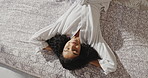 Top view, relax and happy woman in bed at hotel for comfort, resting and morning peace on weekend. Bathrobe, person and lying in bedroom above at spa for calm, wellness and eyes closed for self care
