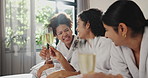 Friends, girls and cheers with wine at spa for pamper day, trip celebration and luxury bonding. Hotel room, happy people or toast with alcohol on bed for holiday break, hospitality or reunion weekend