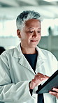 Mature, study or woman in laboratory with tablet, science or gene editing medical experiment. Data scientist, chemistry breakthrough or reading on technology with report, test or research results