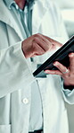 Healthcare, scientist and hands with tablet, lab and online for cure of illness or medical research. Clinic, oncologist and person with tech for analysis, diagnosis and digital records for cancer