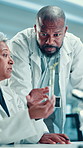 Scientist, team and plant with test tube in laboratory for botany, medical research and discussion. Chemist people, biotechnology and examine sample for pharmaceutical study or sustainable ecology