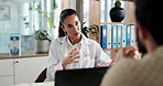 Hospital, laptop and doctor with man in office for appointment, consulting and medical service. Healthcare, talking and person with patient for online results, wellness or diagnosis for treatment