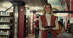 Woman, tablet and walking in library, smile and online reading with scholarship. Happy person, college and student with tech, knowledge or learning with digital app, internet and email with funding