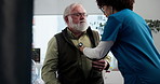Hospital, old man and nurse with stethoscope for consultation, checkup or chest wellness in clinic. Healthcare, senior patient and cardiologist with medical tools for lung health, heartbeat or asthma