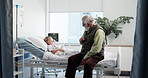Hospital bed, comfort and grandpa with child for empathy, support and care after surgery or treatment. Healthcare, pediatrics and grandfather with girl with diagnosis, medical service and recovery