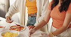 Hands, people and cooking with dough in kitchen for meal preparation, homemade pizza and bonding. Friends, helping and ingredients for spreading sauce, traditional lunch and culinary skills at house