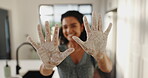 Home, showing and hands with flour, messy or person with baking skills, baker or closeup in kitchen. House, smile and woman with recipe for dessert preparation, confident and fingers with powder