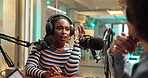 Radio, interview and woman with guest, talk show or discussion for live stream, online or broadcast. Happy, journalist and people with mic for conversation, digital and chat for media production