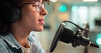 Talking, headphones and man with microphone for podcast, multimedia or radio DJ in studio. Audio equipment, reporter and person with recording for online broadcast, announcement or live streaming.