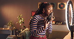 Influencer, ring light or black woman live streaming with bag for surprise package, review or night. Happy content creator, video recording or promo with designer brand sponsor or fans update in home