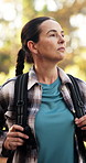 Hiking, mature woman and walking in forest for travel adventure, sightseeing nature and fresh air. Backpacker, trekking or backpack in woods with exploring scenery, holiday journey and wellness hobby
