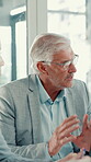 Business, man and talk in meeting in office for financial planning, feedback or budget review. Mature person, team and discussion of finance update, investment report and information of profit growth
