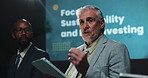 Business people, presentation and man with tablet, speaker and sustainability with investments. Employees, investor and presenter with tech, mature person and feedback for software update and app
