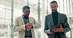 Businessmen, walking or checking time with watch or tablet at office building for business schedule. Male people, employee or colleagues with technology or preparation for corporate meeting or agenda